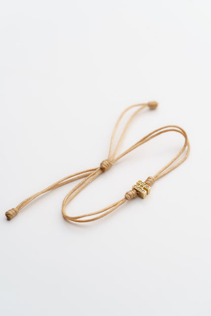 40. PULSERA TEJIDA CON INICIAL CON CIRCONES